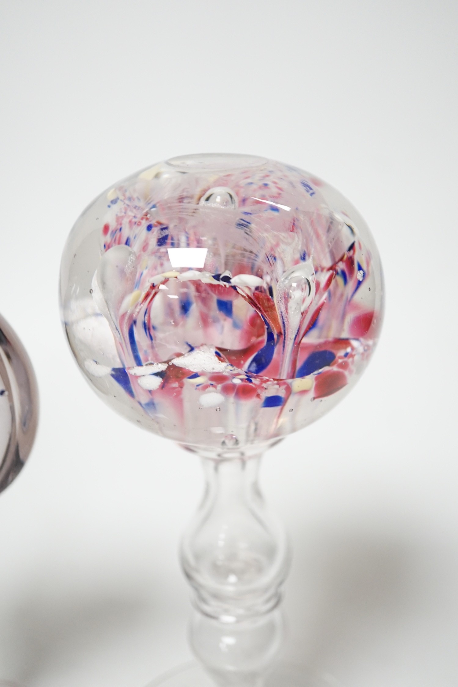 Two 19th century glass pedestal ornaments, one possibly a wig stand, the other containing a sulphide of Saint John the Baptist, Tallest 20cm